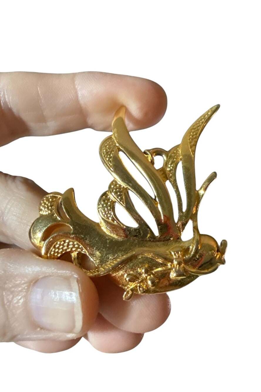 Vintage Gold Tone Dove Pendant With Textured Wings And Floral Accents